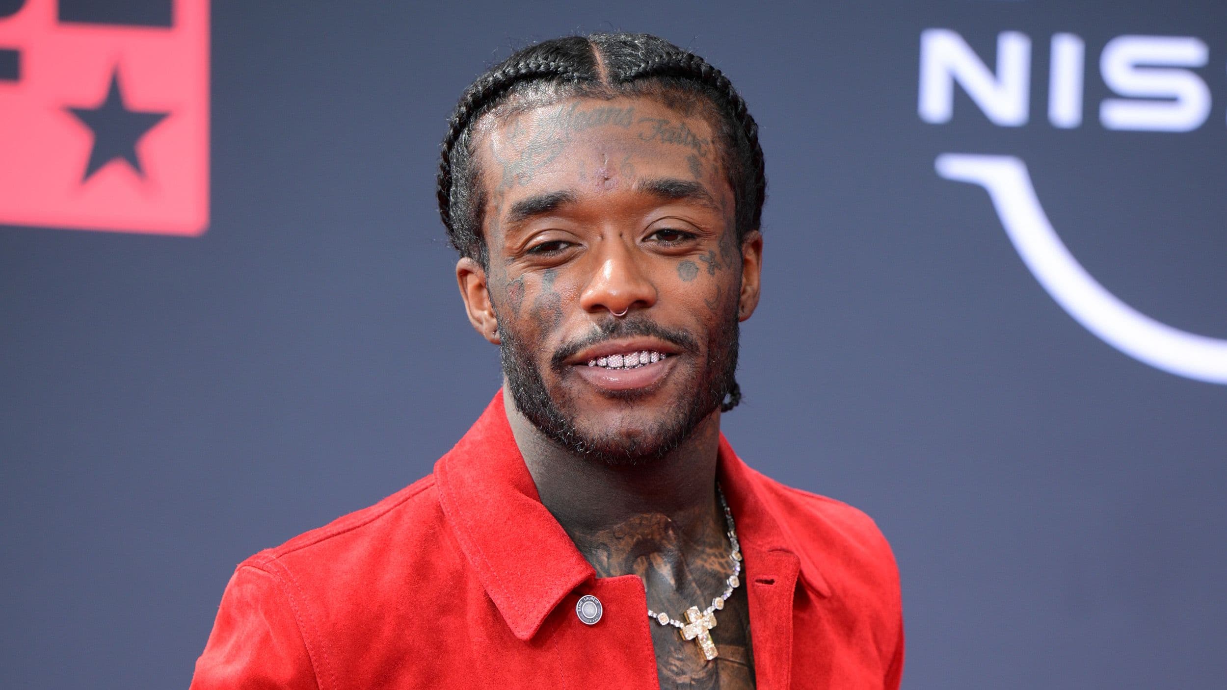 Headshot of the young rapper Lil Uzi on the red carpet of some awards event.